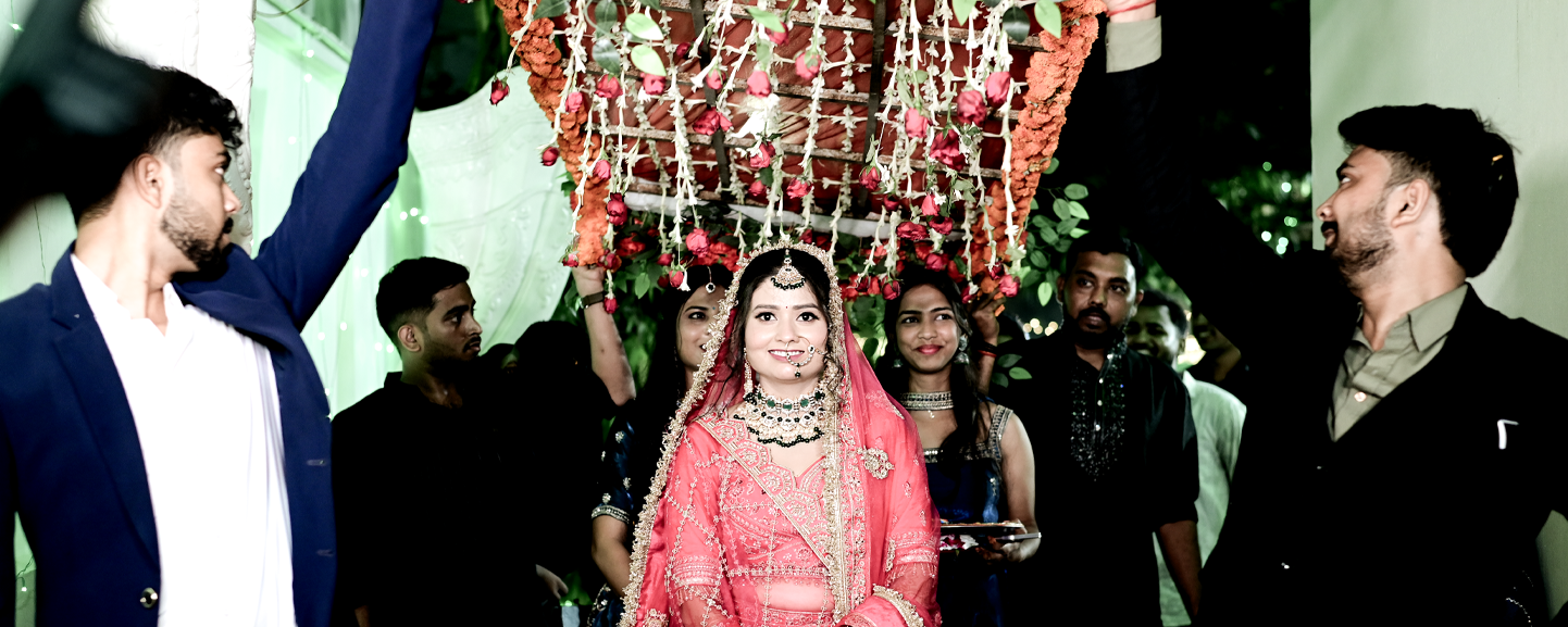 Grand bridal entry under phoolon ki chadar - Wedding photography in Patna by Designinfo Photography